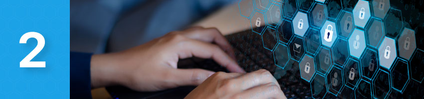 A person typing on a laptop with locks in the background