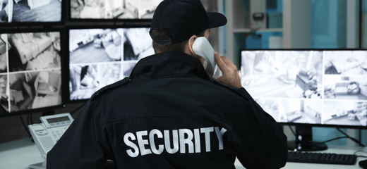 A secuity officer making a phone call from a security centre