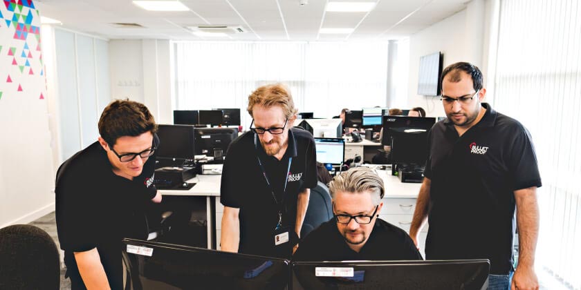 The Bulletproof team overlooking a penetration test on a monitor