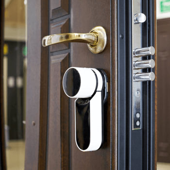 A smart door lock An open door with a smart lock